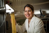 Separating pasta in California Wheat Commission laboratory.